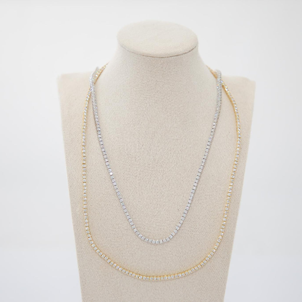 Necklace displayed on a mannequin bust against a white background